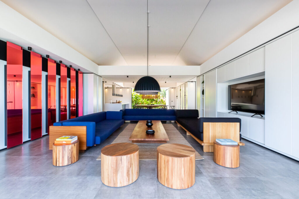 Spacious living room with blue and black seating at Villa Valentina, St. Barts.